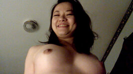 AsianSlutwife smile and tits.jpg